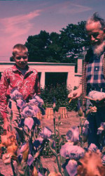 REX STOUT with young visitor in his garden REX STOUT with young visitor in his garden